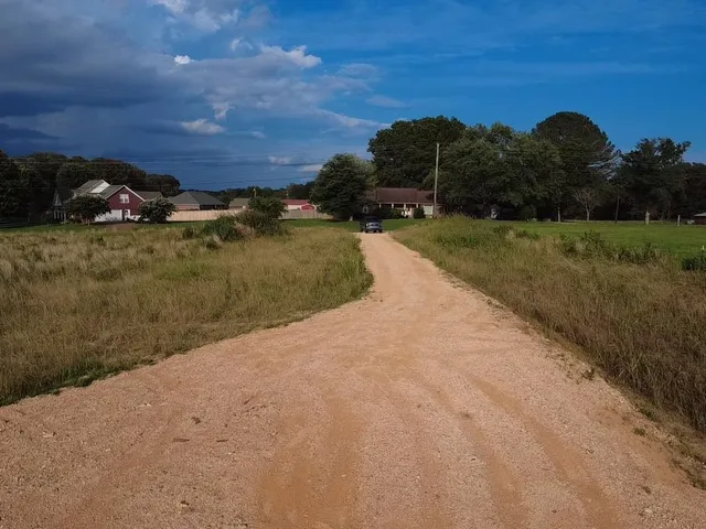 a view of a road with an ocean view