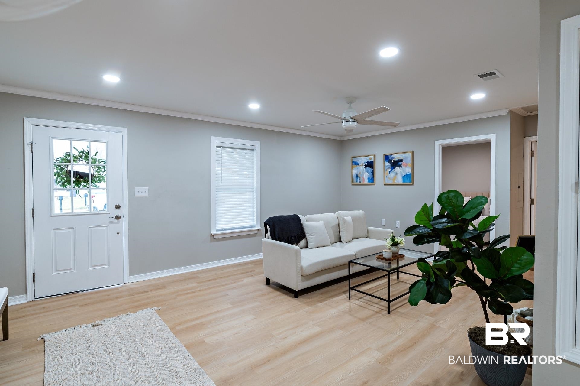 13474 Rooster Lane Foley, AL 36535 - Photo 9 of 39 Living room with baseboards, recessed lighting, light wood-style floors, and ornamental molding