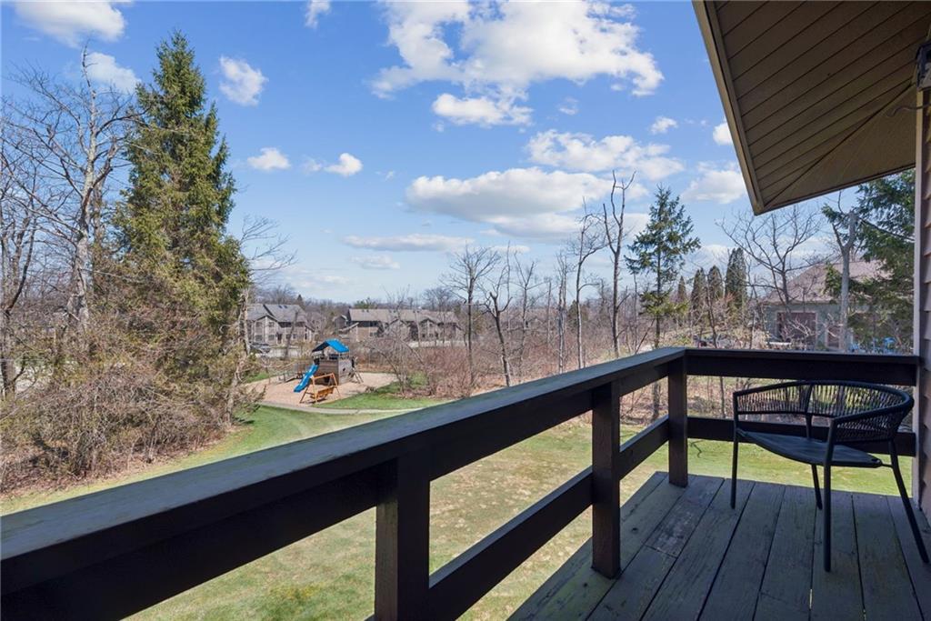1223 Veech Lane Hidden Valley, PA 15502 - Photo 20 of 30 a view of a balcony with chair and wooden floor