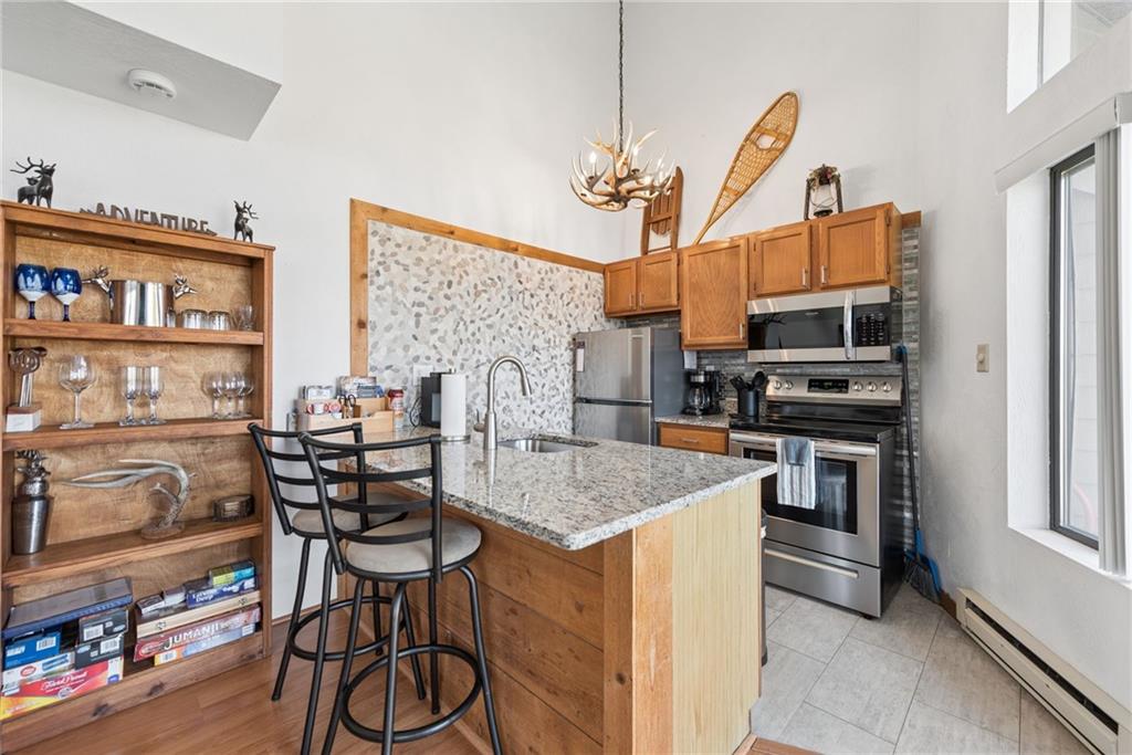1223 Veech Lane Hidden Valley, PA 15502 - Photo 6 of 30 a kitchen that has a table chairs and a refrigerator