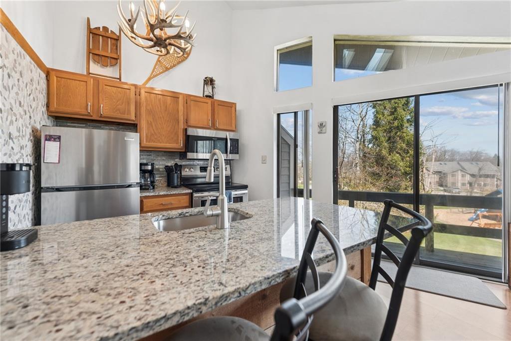 1223 Veech Lane Hidden Valley, PA 15502 - Photo 7 of 30 a view of a dining room kitchen and windows