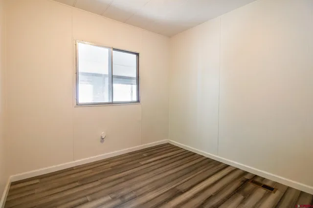 a view of a living room and kitchen