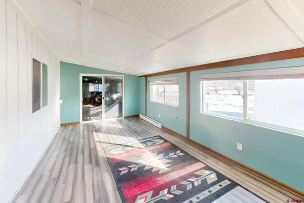a view of a balcony with wooden floor