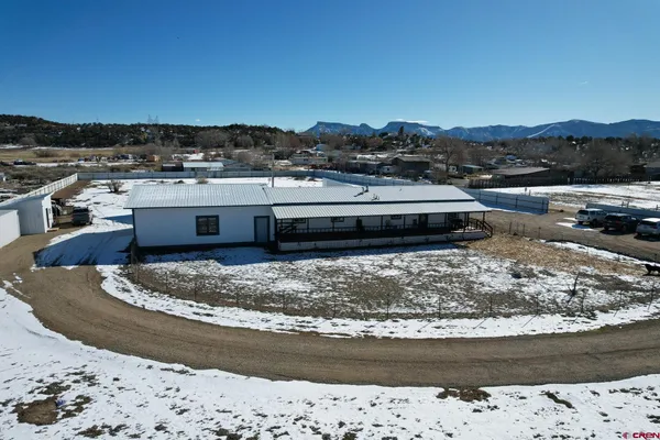a view of hallway with wooden floor