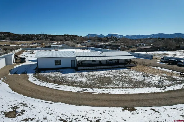 a view of hallway with wooden floor