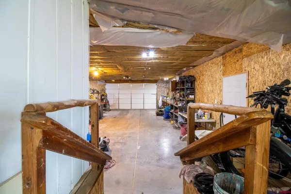 a view of a garage with cars