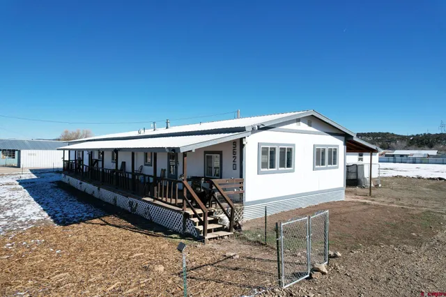 a view of a balcony with furniture