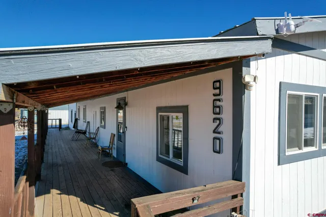 a bedroom with a bed and mirror