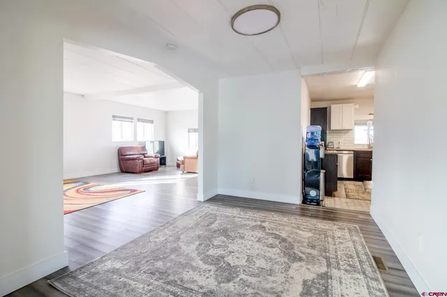 a kitchen with granite countertop a sink and cabinets