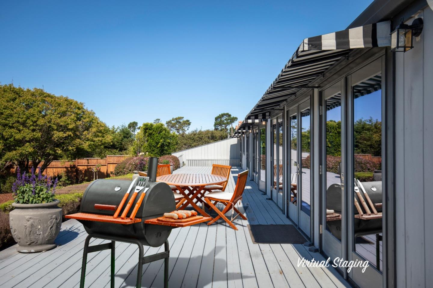 1604 Viscaino Road Pebble Beach, CA 93953 - Photo 7 of 25 a balcony with outdoor seating and wooden floor