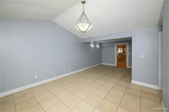 a view of an empty room and a window