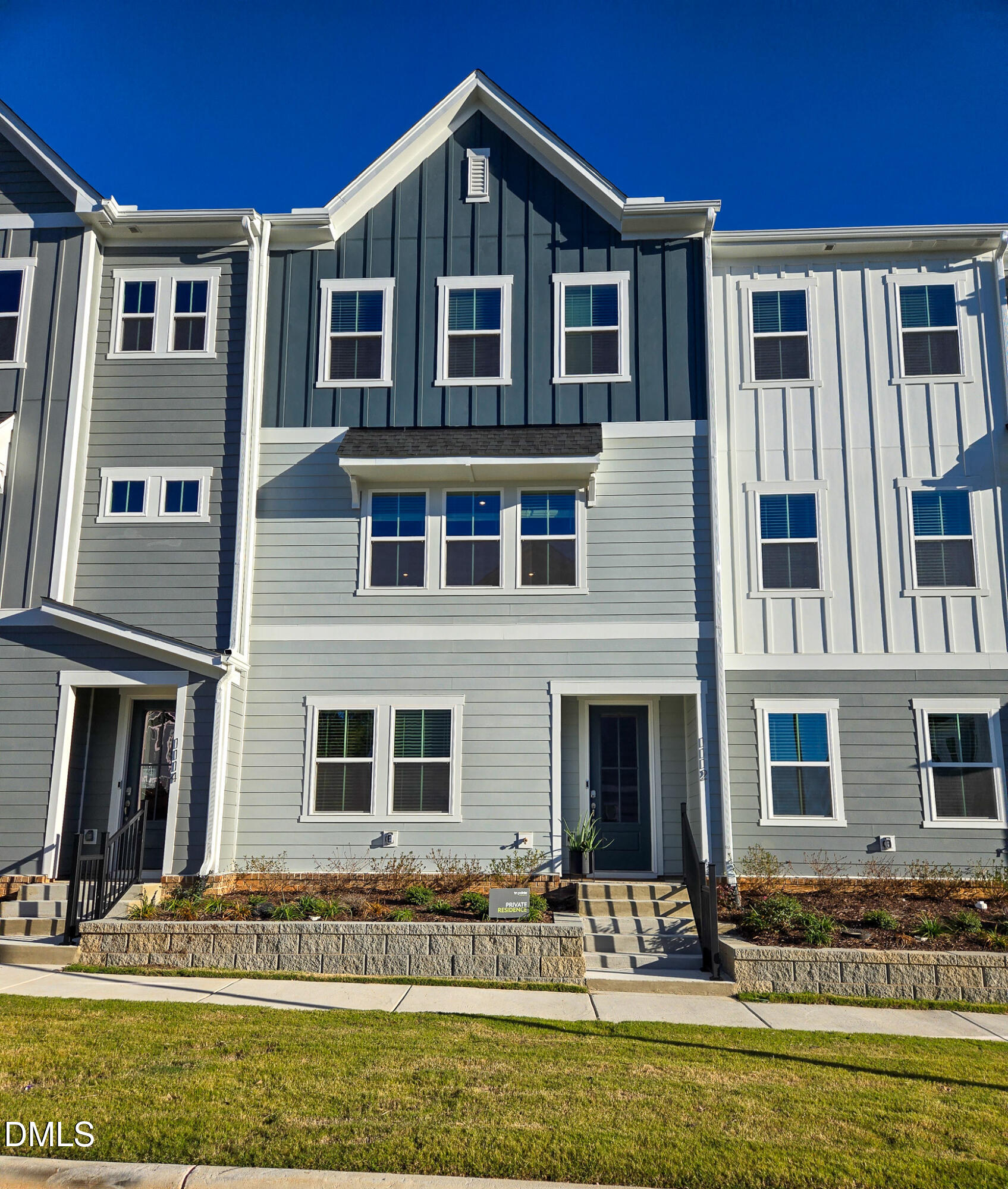 1112 Holding Village Way Wake Forest, NC 27587 - Photo 1 of 45 a front view of a house with a yard