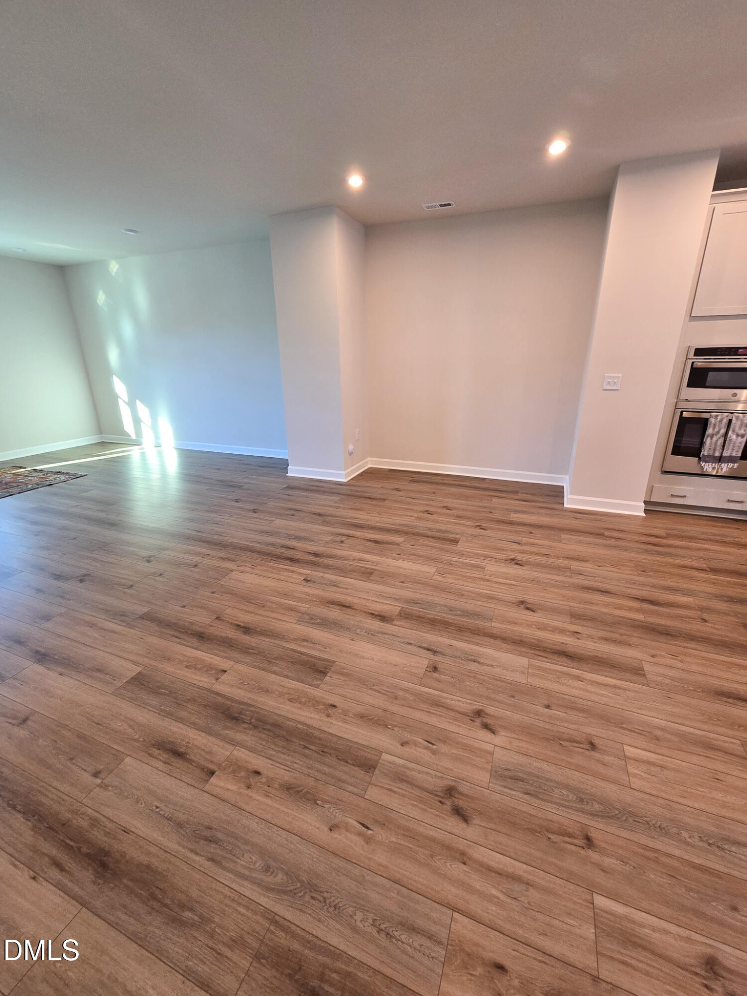 1112 Holding Village Way Wake Forest, NC 27587 - Photo 16 of 45 a view of empty room with wooden floor