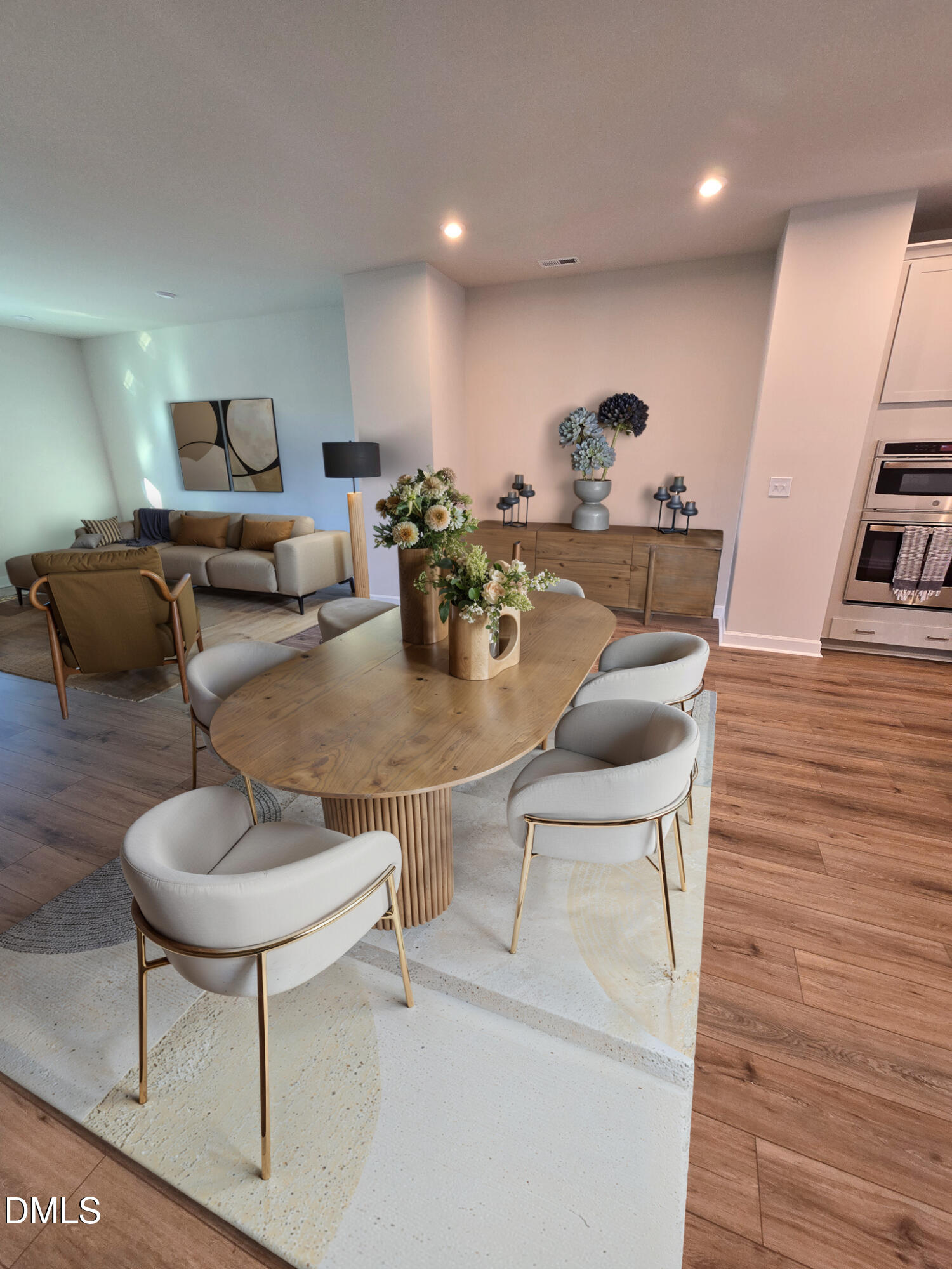 1112 Holding Village Way Wake Forest, NC 27587 - Photo 17 of 45 a living room with furniture and a wooden floor