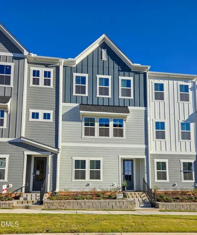a front view of a building with a swimming pool