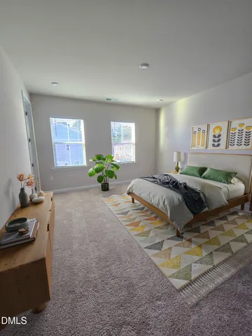 a bedroom with a bed and a couch