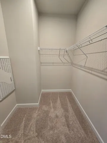 a view of a room with racks on the wall