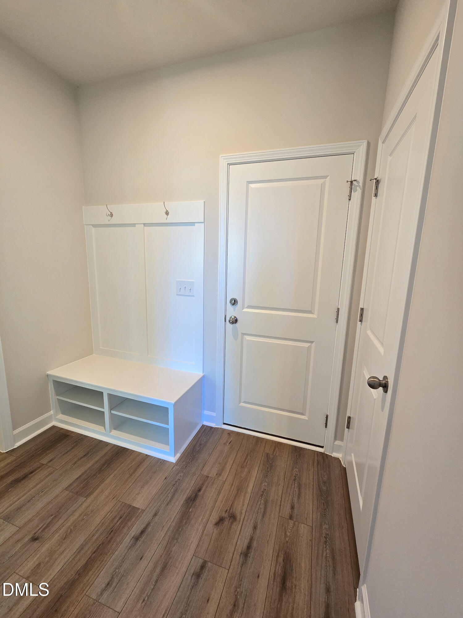 1112 Holding Village Way Wake Forest, NC 27587 - Photo 4 of 45 a view of an empty room with wooden floor and a window