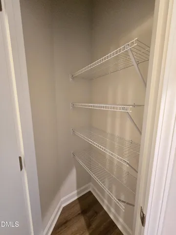 a view of a roof deck with wooden floor and city view