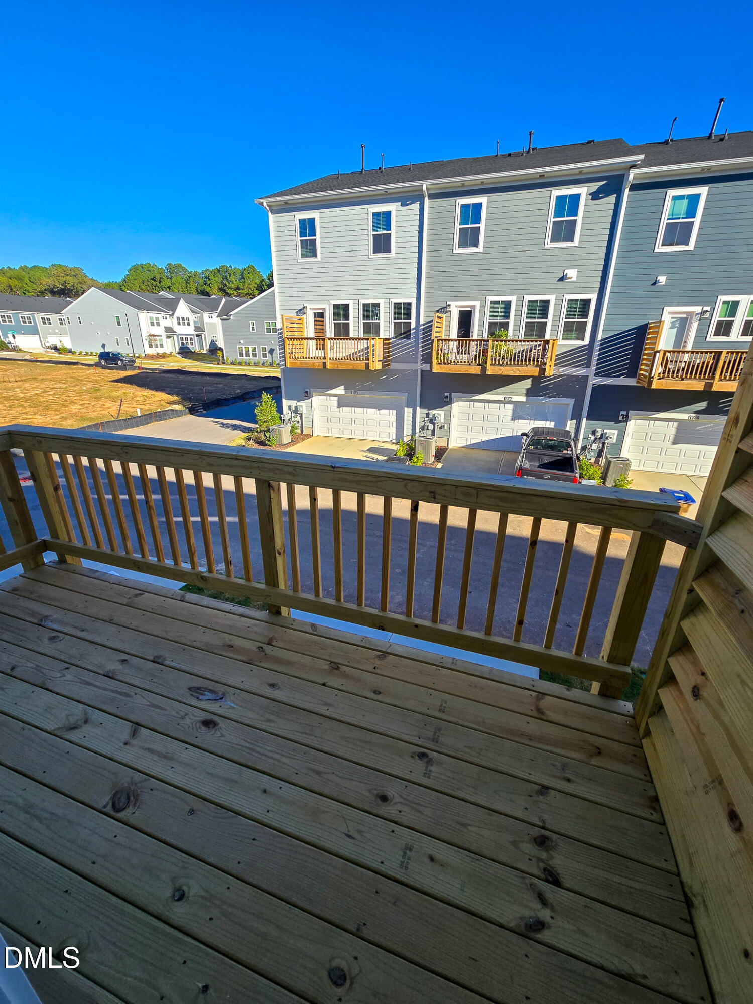 1112 Holding Village Way Wake Forest, NC 27587 - Photo 42 of 45 a view of a roof deck with wooden floor and city view