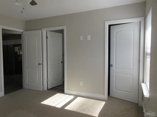 an empty room with a bathroom