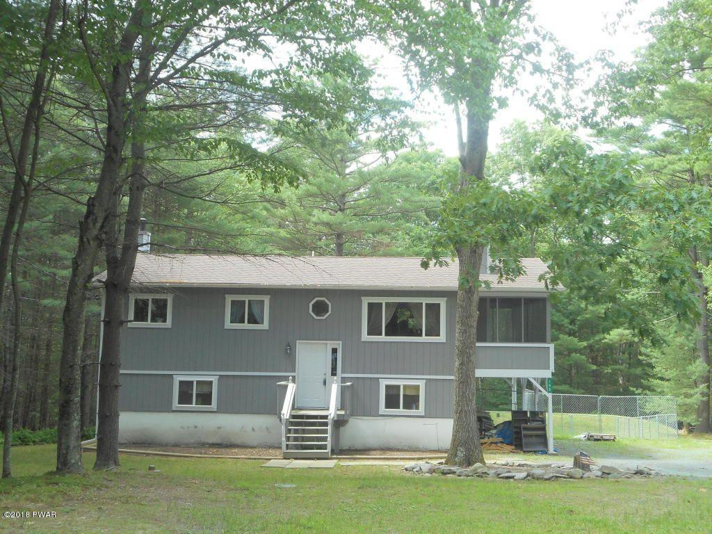 195 Fox Road Dingmans Ferry, PA 18328 - Photo 1 of 16 a front view of a house with a yard