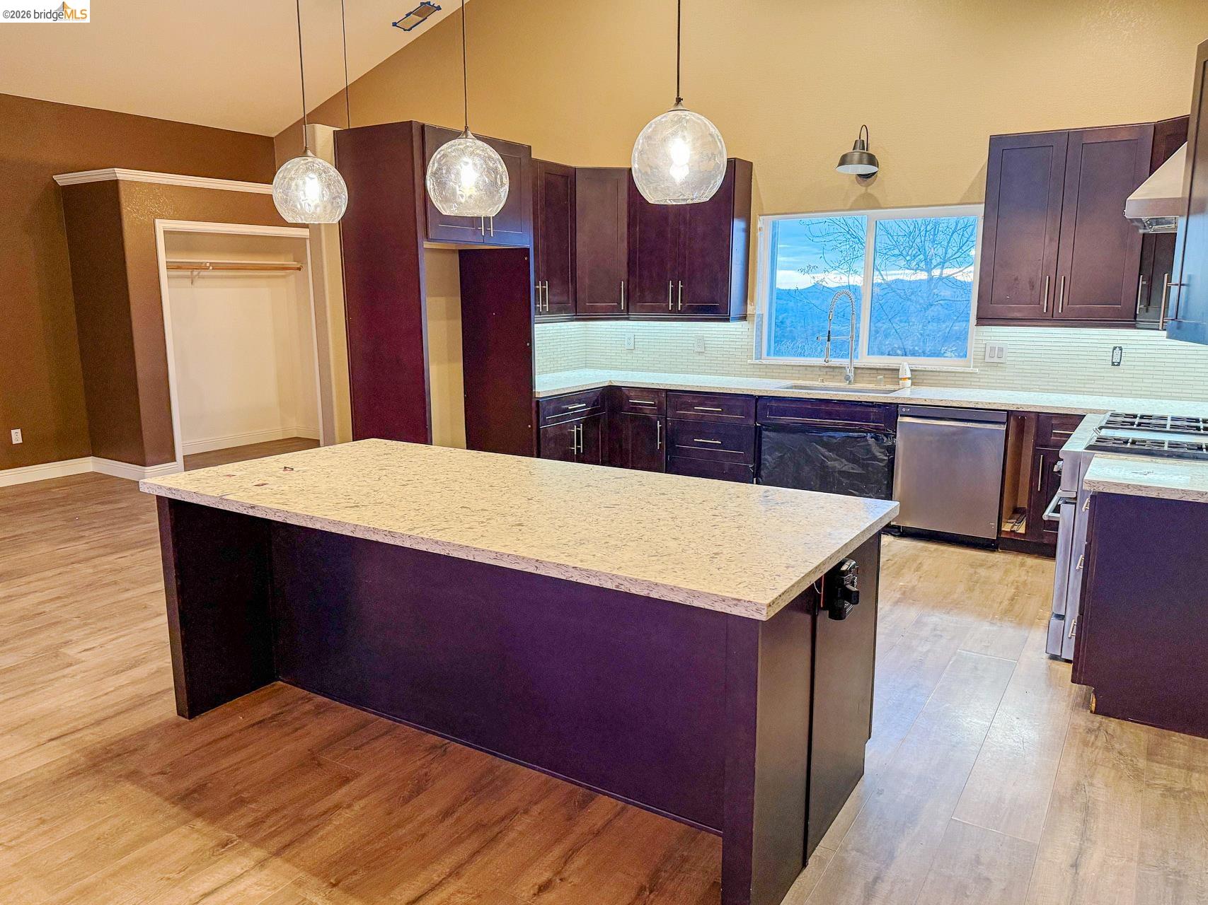 16446 Stamp Mill Loop Road East Jamestown, CA 95327 - Photo 11 of 32 a kitchen with a wooden table and chairs
