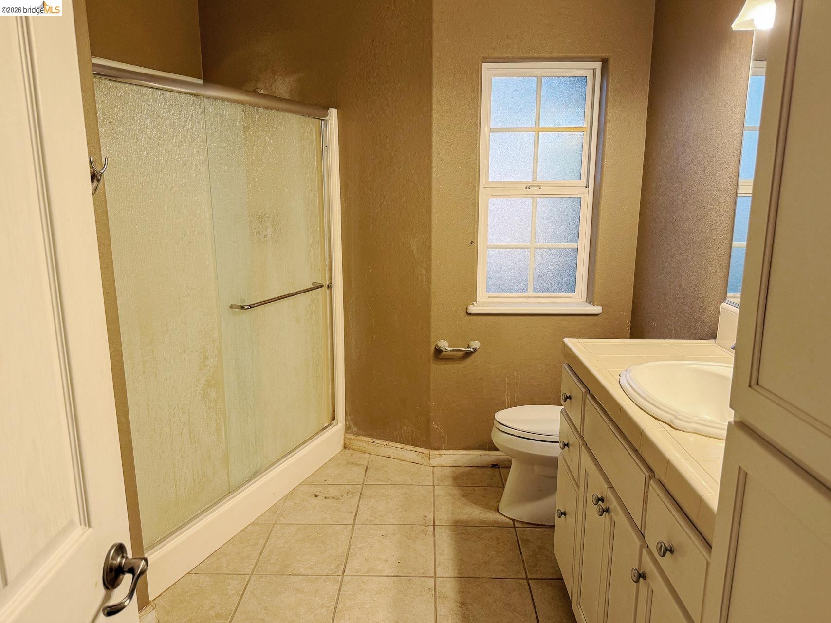 16446 Stamp Mill Loop Road East Jamestown, CA 95327 - Photo 20 of 32 a bathroom with a granite countertop sink toilet and shower