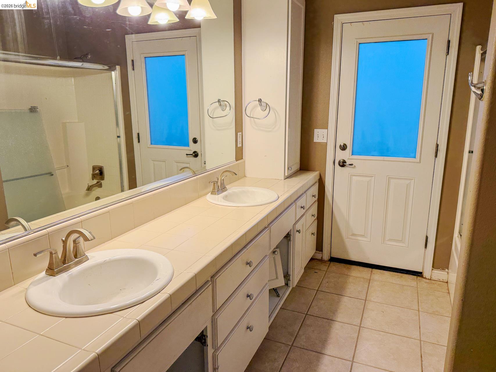 16446 Stamp Mill Loop Road East Jamestown, CA 95327 - Photo 22 of 32 a bathroom with a sink and a mirror