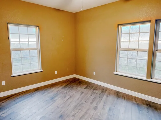 an empty room with windows