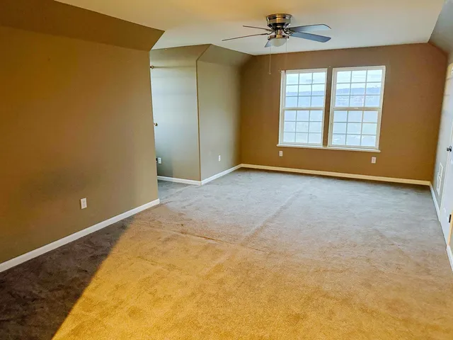a bathroom with a sink mirror vanity and toilet