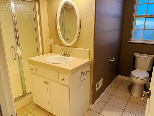 a kitchen with white cabinets and a sink