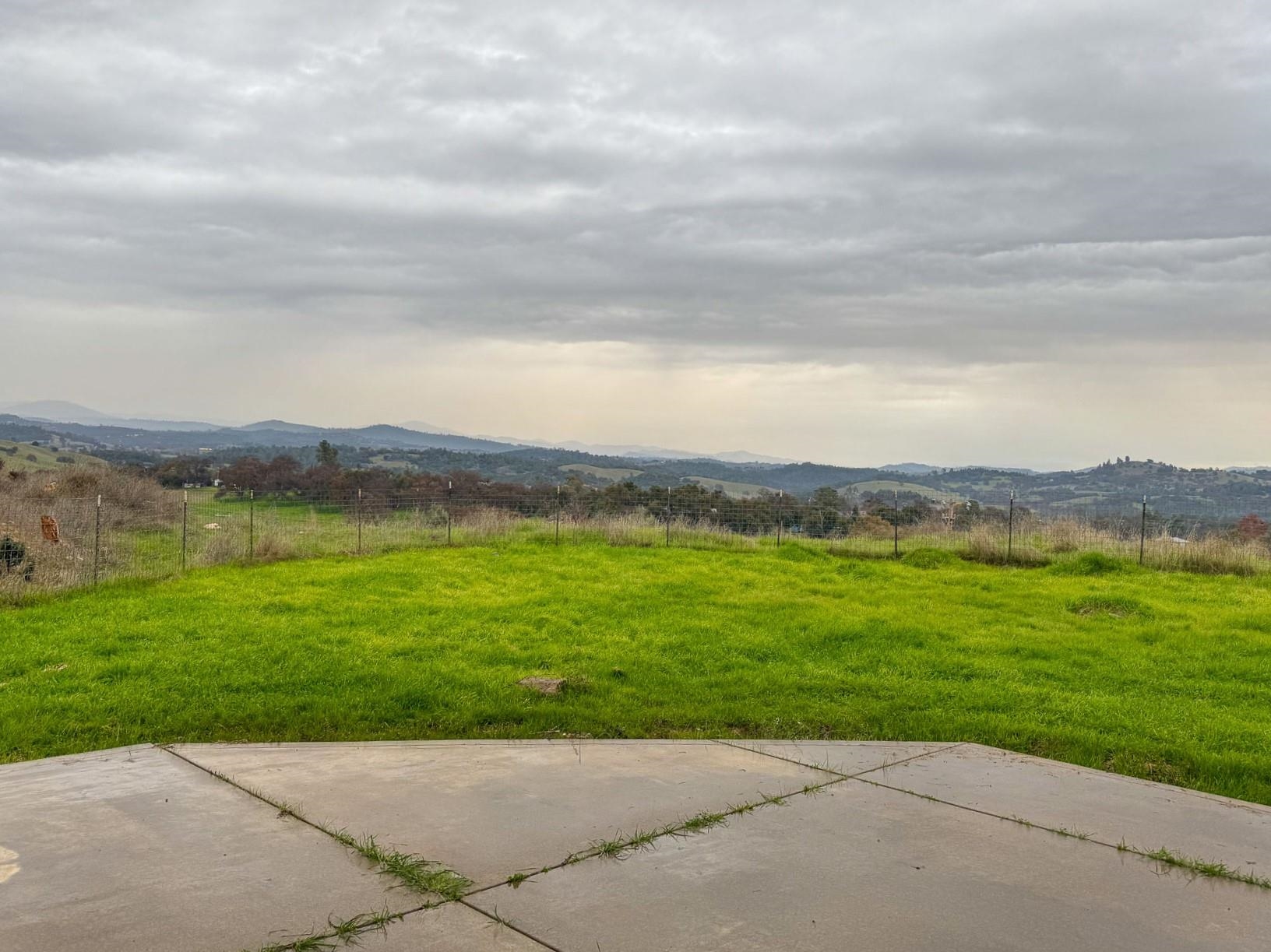 16446 Stamp Mill Loop Road East Jamestown, CA 95327 - Photo 31 of 32 a view of a grassy field with an ocean
