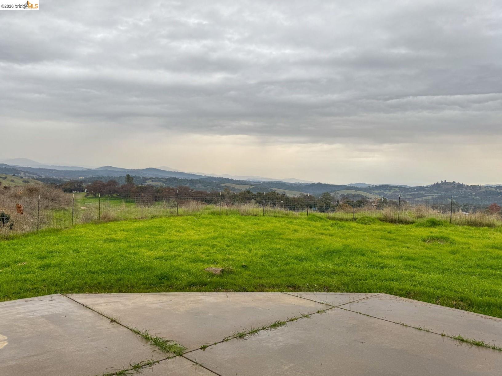 16446 Stamp Mill Loop Road East Jamestown, CA 95327 - Photo 31 of 32 a view of a grassy field with an ocean