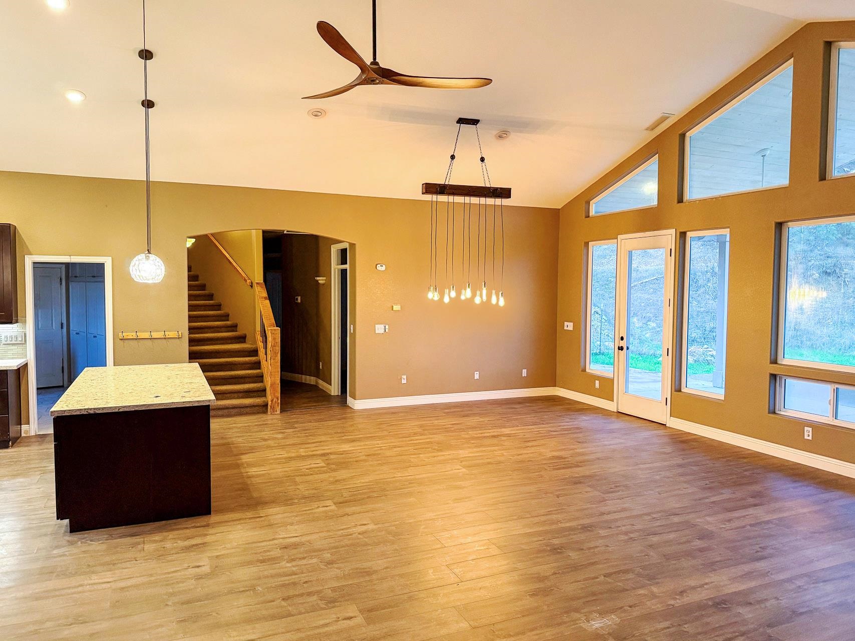 16446 Stamp Mill Loop Road East Jamestown, CA 95327 - Photo 6 of 32 a view of an empty room with stairs and a floor to ceiling window