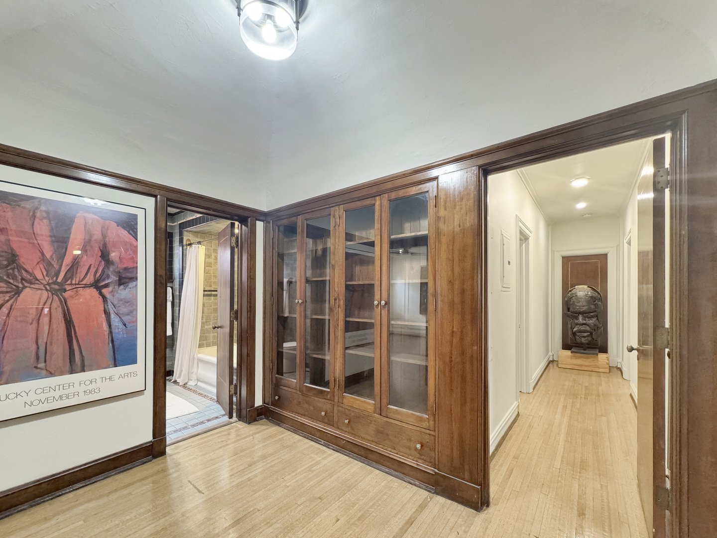 6909 South Chappel Avenue Chicago, IL 60649 - Photo 12 of 60 a view of a hallway with bathroom and front door