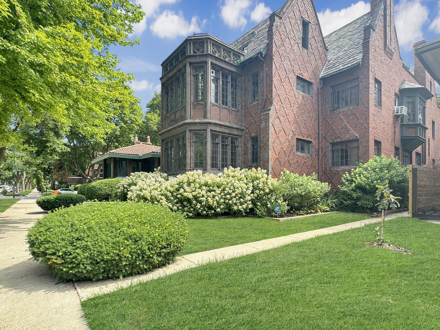 6909 South Chappel Avenue Chicago, IL 60649 - Photo 2 of 60 a front view of a house with a garden