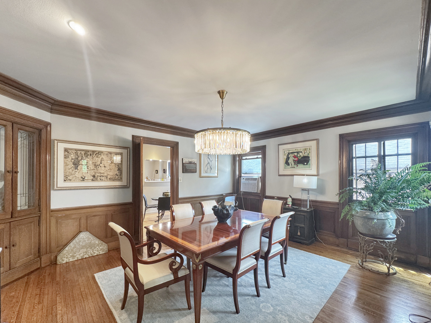 6909 South Chappel Avenue Chicago, IL 60649 - Photo 25 of 60 a view of a dining room with furniture window and wooden floor