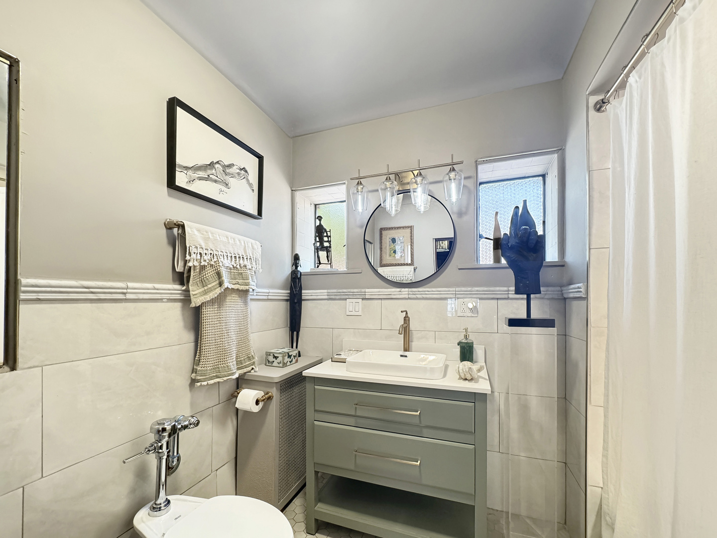 6909 South Chappel Avenue Chicago, IL 60649 - Photo 30 of 60 a bathroom with a toilet a sink and mirror