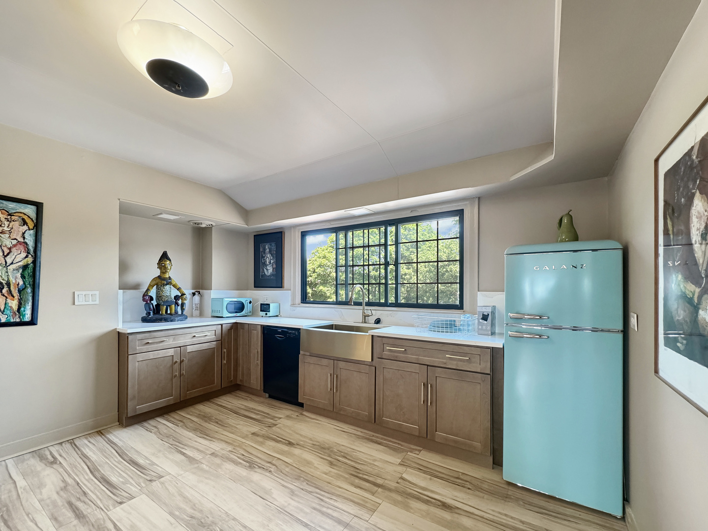 6909 South Chappel Avenue Chicago, IL 60649 - Photo 38 of 60 a kitchen with stainless steel appliances granite countertop a sink and dishwasher a refrigerator with wooden cabinets