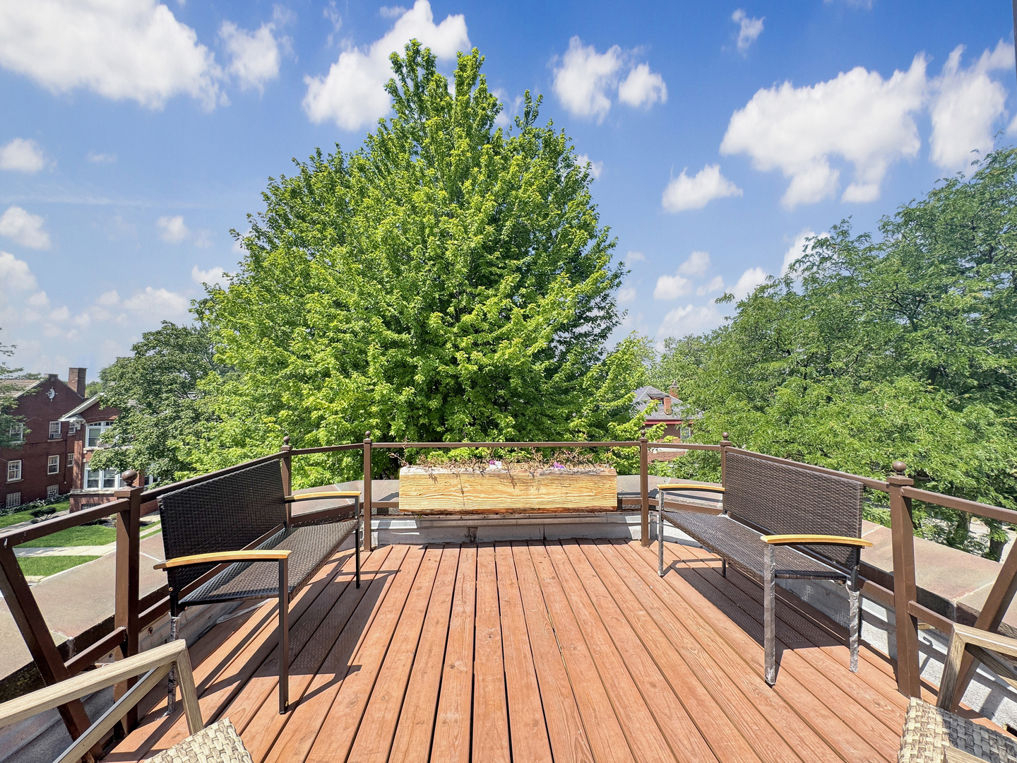 6909 South Chappel Avenue Chicago, IL 60649 - Photo 41 of 60 a view of balcony with wooden floor and outdoor seating
