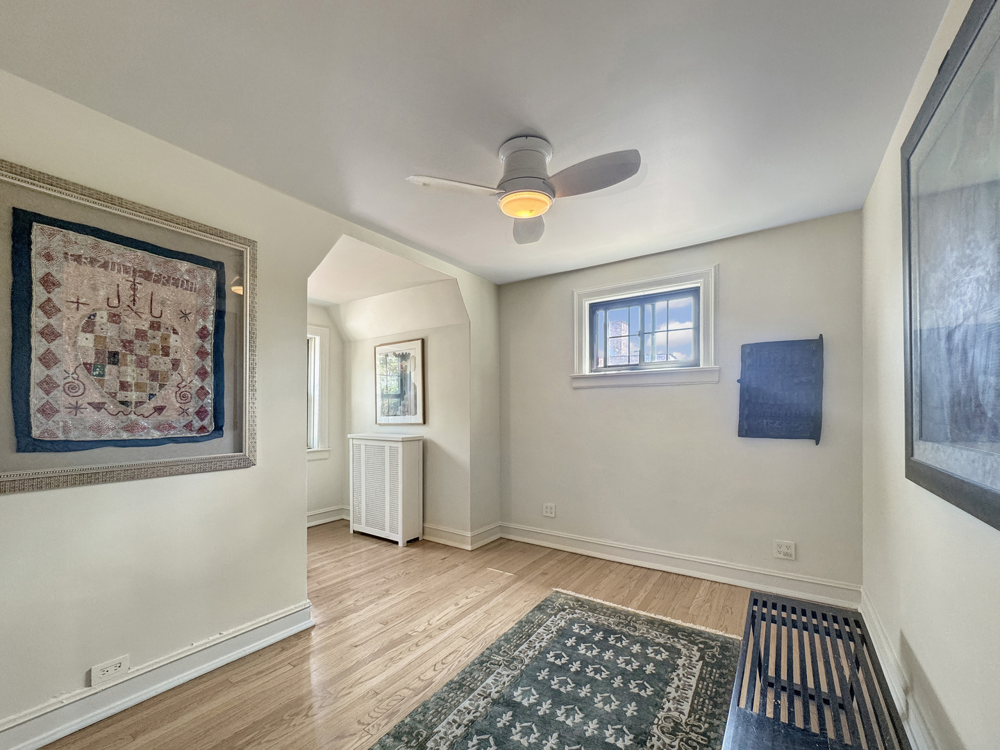 6909 South Chappel Avenue Chicago, IL 60649 - Photo 44 of 60 a view of an empty room with window and wooden floor