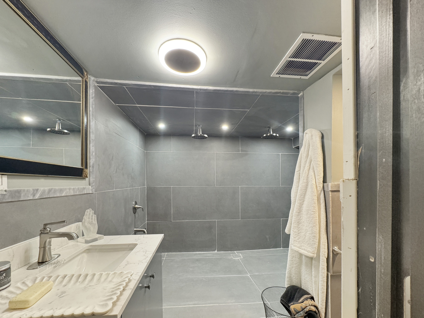 6909 South Chappel Avenue Chicago, IL 60649 - Photo 51 of 60 a bathroom with a sink and a mirror