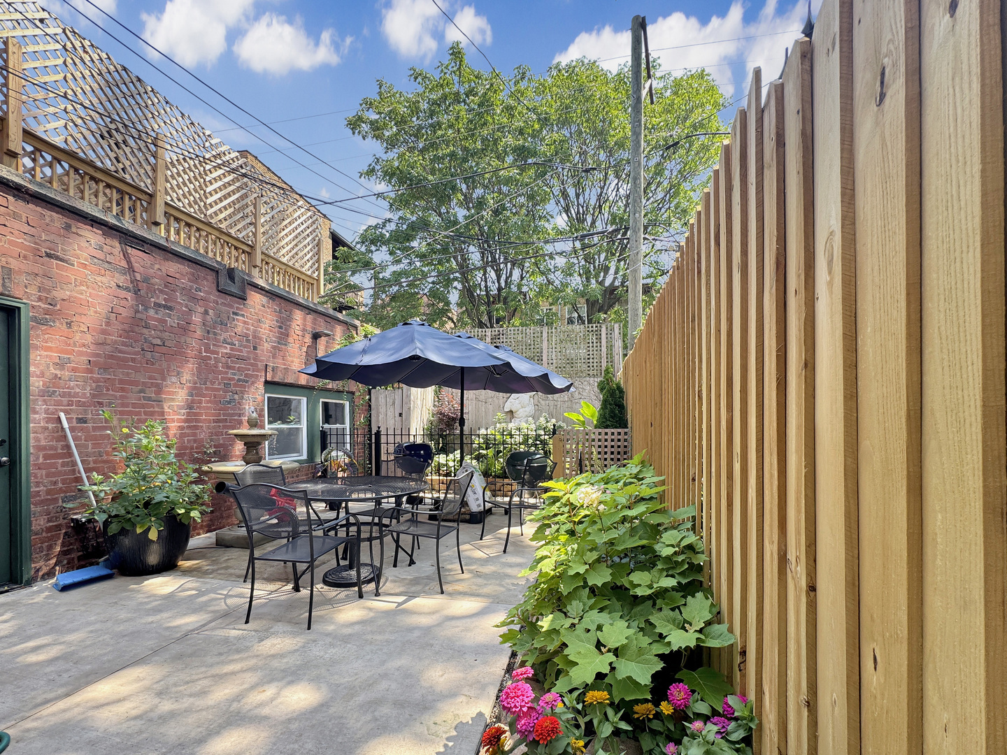 6909 South Chappel Avenue Chicago, IL 60649 - Photo 53 of 60 a view of a patio with chairs and plants