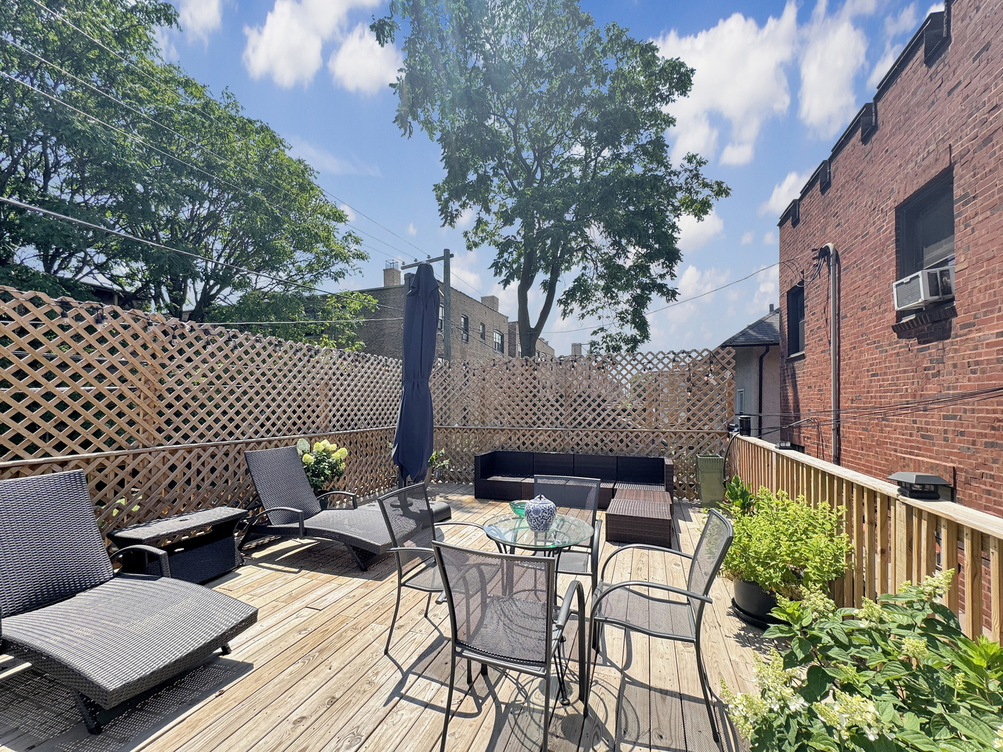 6909 South Chappel Avenue Chicago, IL 60649 - Photo 58 of 60 a view of a patio with two chairs and a table