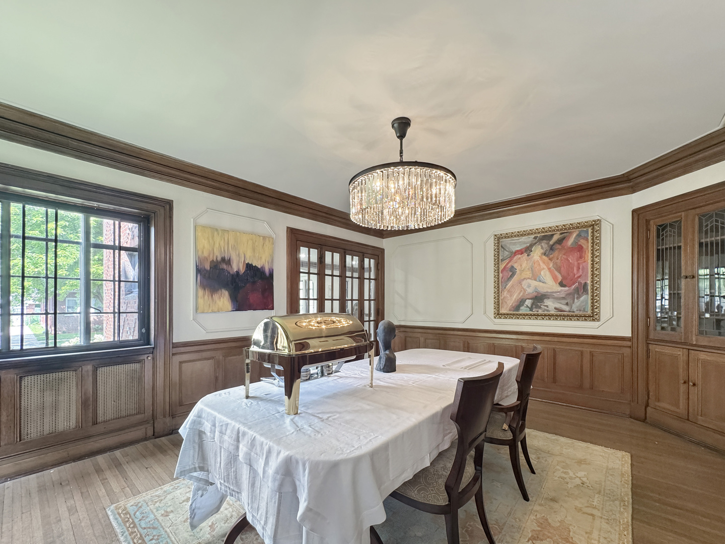 6909 South Chappel Avenue Chicago, IL 60649 - Photo 7 of 60 a view of a dining room with furniture window and wooden floor
