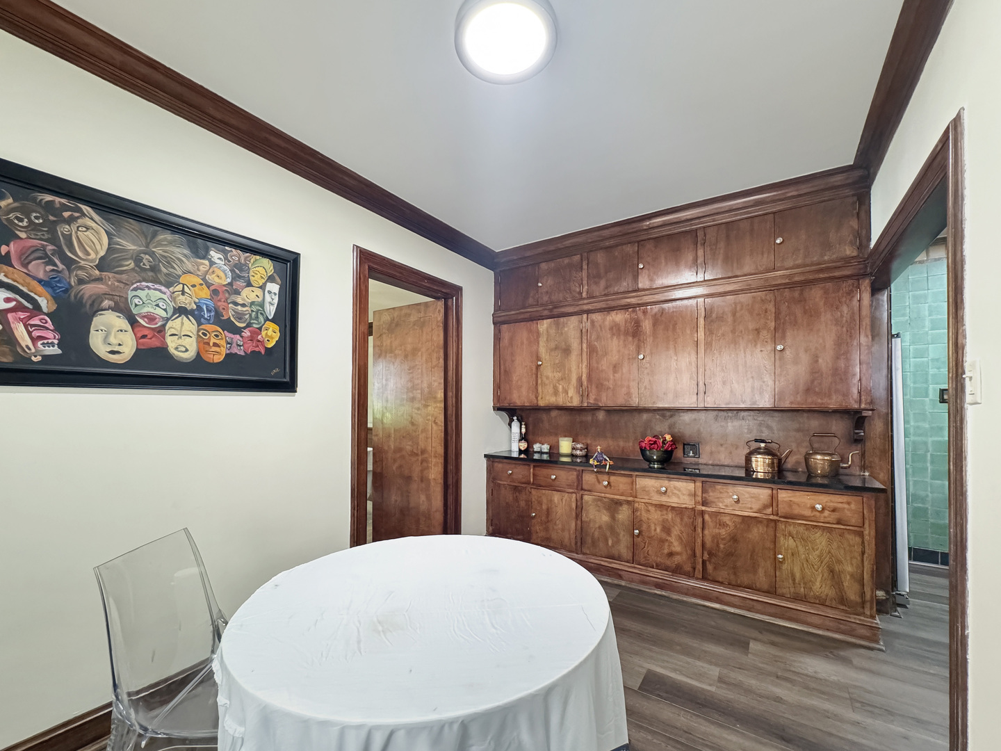 6909 South Chappel Avenue Chicago, IL 60649 - Photo 9 of 60 a kitchen with stainless steel appliances a refrigerator and wooden floor