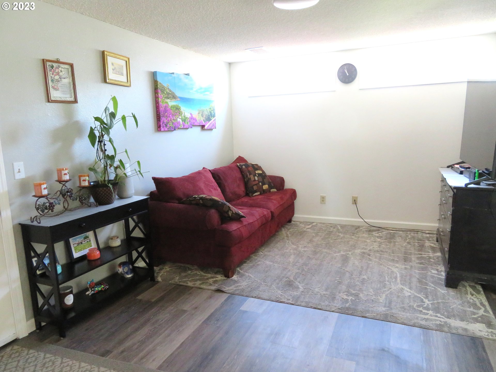 4440 Southwest 194th Court Beaverton, OR 97078 - Photo 15 of 32 a living room with furniture and a flat screen tv