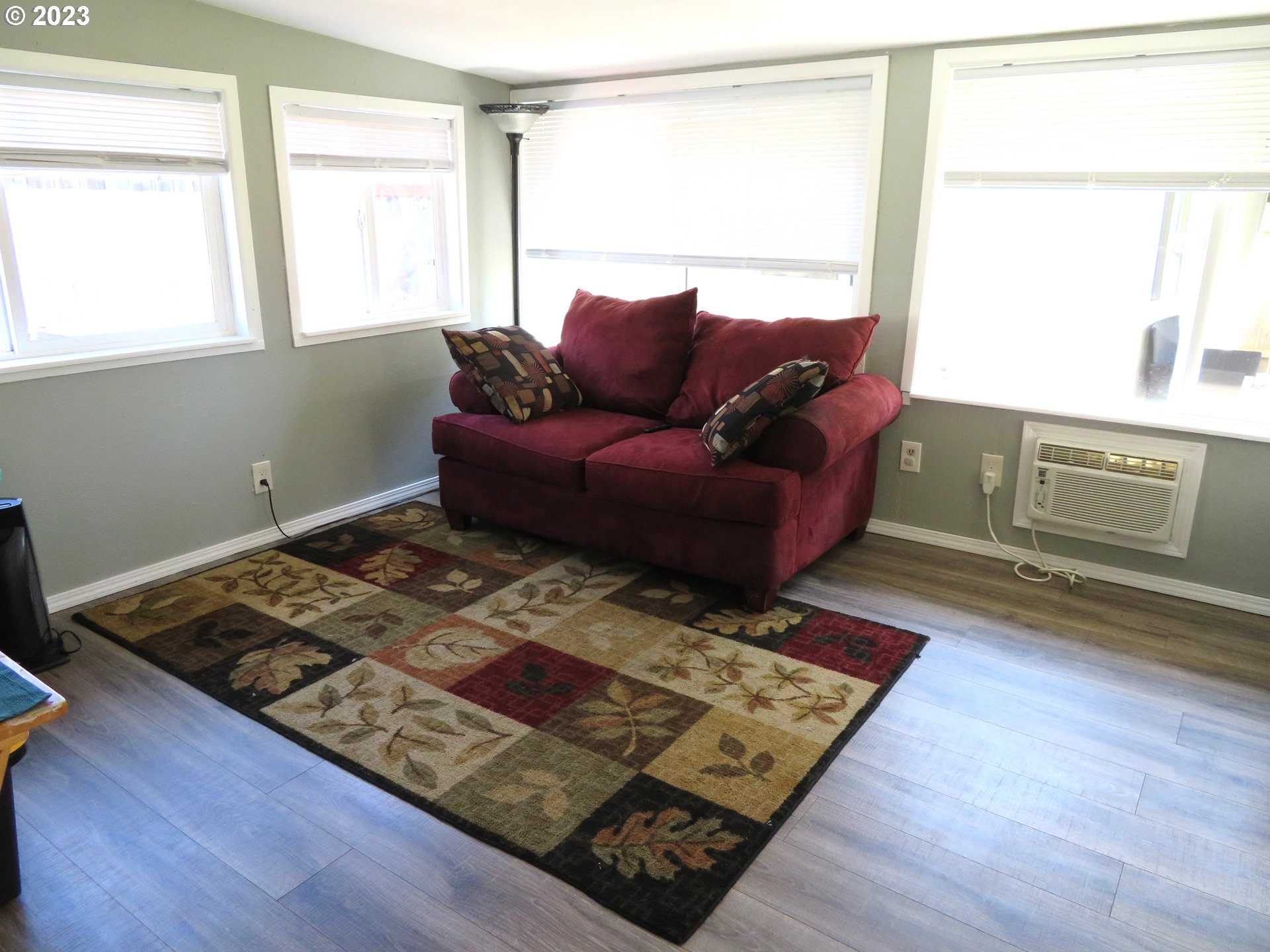 4440 Southwest 194th Court Beaverton, OR 97078 - Photo 17 of 32 a living room with a couch and a window