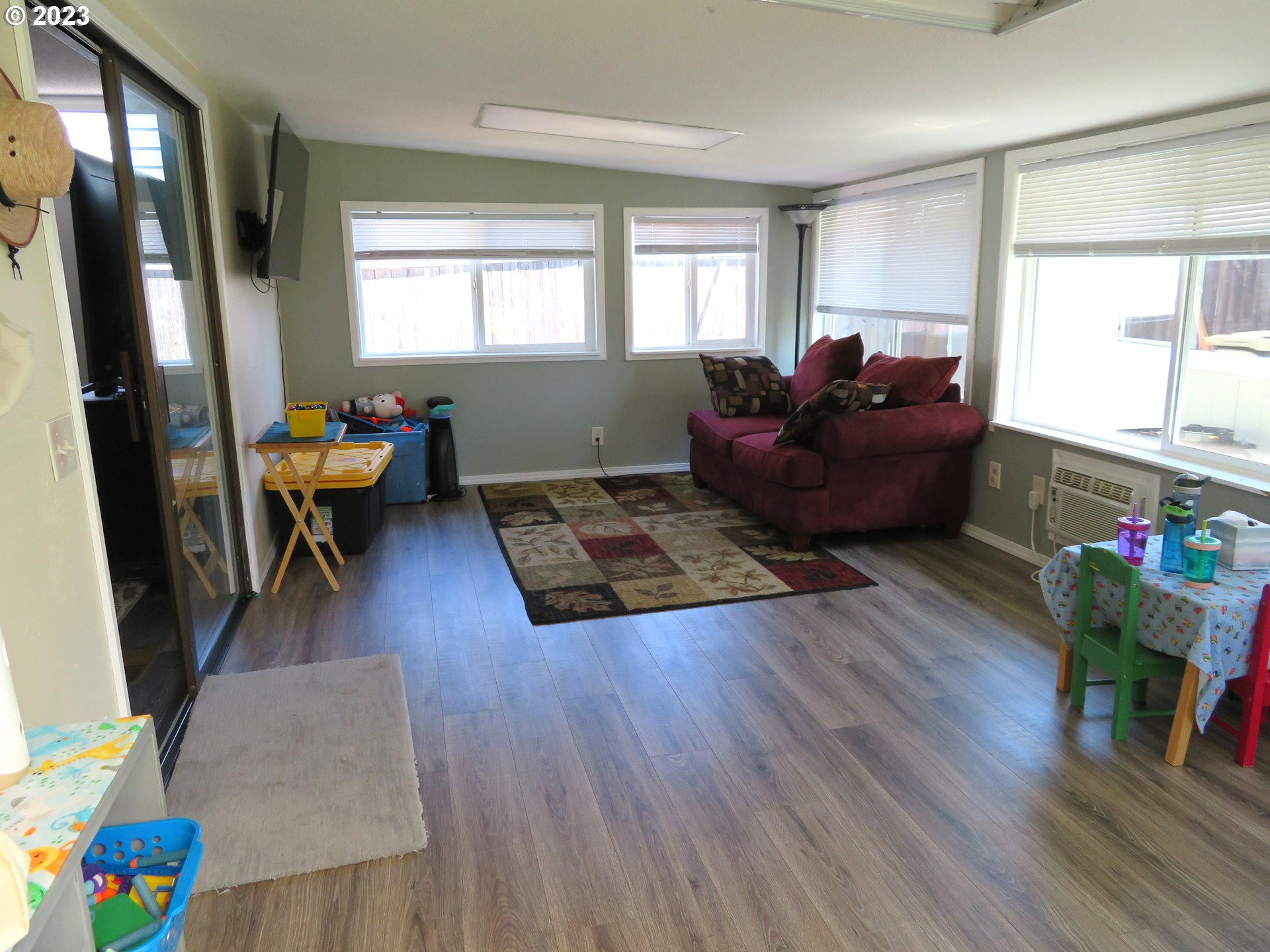4440 Southwest 194th Court Beaverton, OR 97078 - Photo 18 of 32 a living room with furniture and a wooden floor